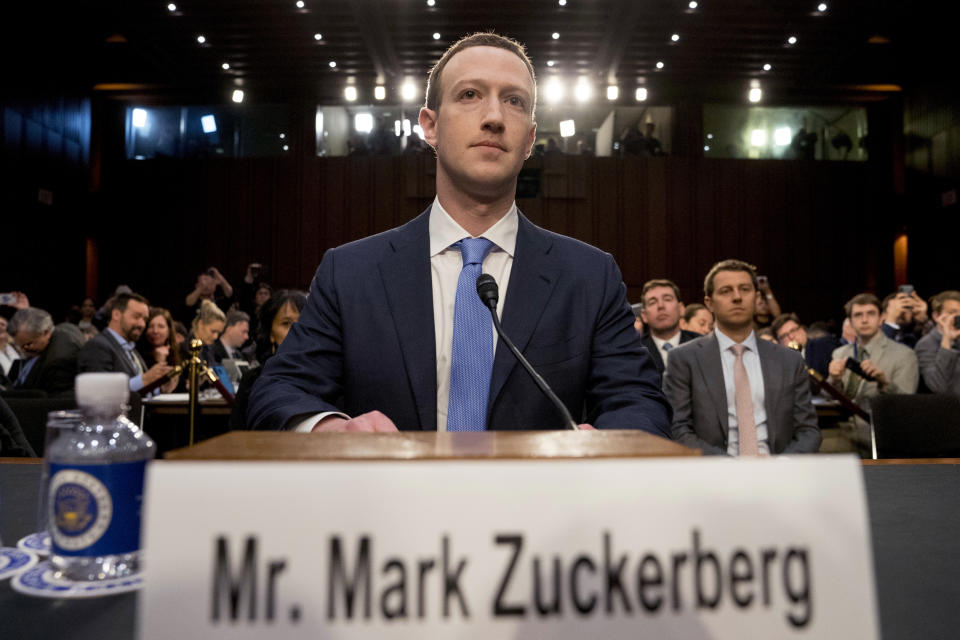 FILE - In this Tuesday, April 10, 2018 file photo, Facebook CEO Mark Zuckerberg arrives to testify before a joint hearing of the Commerce and Judiciary Committees on Capitol Hill in Washington. Holocaust survivors around the world are lending their voices to a campaign launched Wednesday, July 29, 2020, targeting Facebook head Mark Zuckerberg, urging him to take action to remove denial of the Nazi genocide from the social media site. (AP Photo/Andrew Harnik)