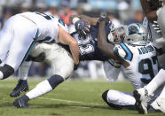 <p>Dallas Cowboys’ Ezekiel Elliott (21) is tackled by Carolina Panthers’ Mario Addison (97) during the first half of an NFL football game in Charlotte, N.C., Sunday, Sept. 9, 2018. (AP Photo/Mike McCarn) </p>