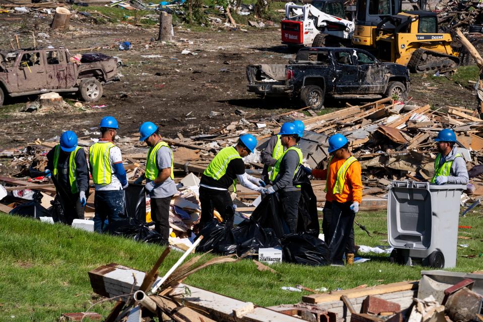 Construction crews work to begin recovery efforts on Thursday, May 23, 2024, after a powerful EF4 tornado hit Greenfield, Iowa, on Tuesday.