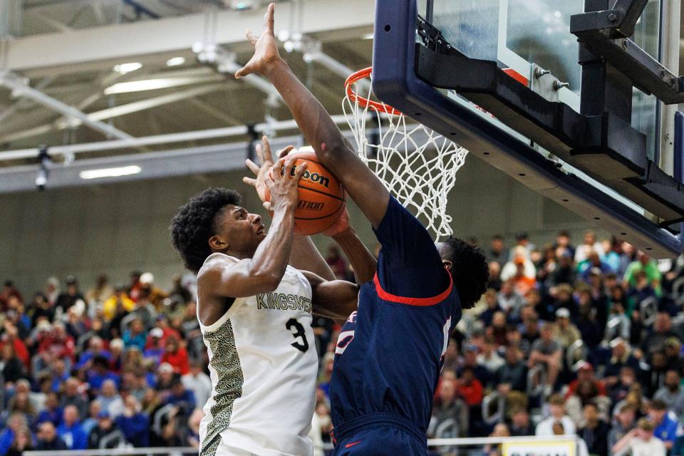 Penn’s Markus Burton (3) goes up for a shot as Kokomo's Flory Bidunga (40) defends during the Penn-Kokomo high school 4A Semi-State Championship basketball game on Saturday, March 18, 2023, at Michigan City High School in Michigan City, Indiana.