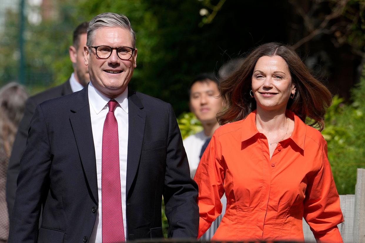 Labour Party leader Keir Starmer and wife Victoria arrive at a polling station to cast their vote in London, Thursday, July 4, 2024. Voters in the U.K. are casting their ballots in a national election to choose the 650 lawmakers who will sit in Parliament for the next five years. Outgoing Prime Minister Rishi Sunak surprised his own party on May 22 when he called the election. (AP Photo/Vadim Ghirda)