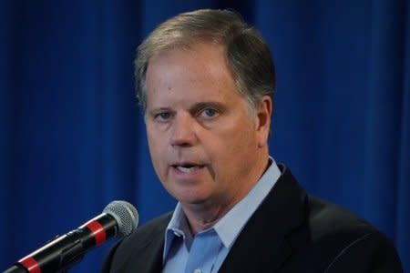 Democratic Senator-elect Doug Jones holds a press briefing in Birmingham, Alabama, U.S., December 13, 2017. REUTERS/Carlo Allegri