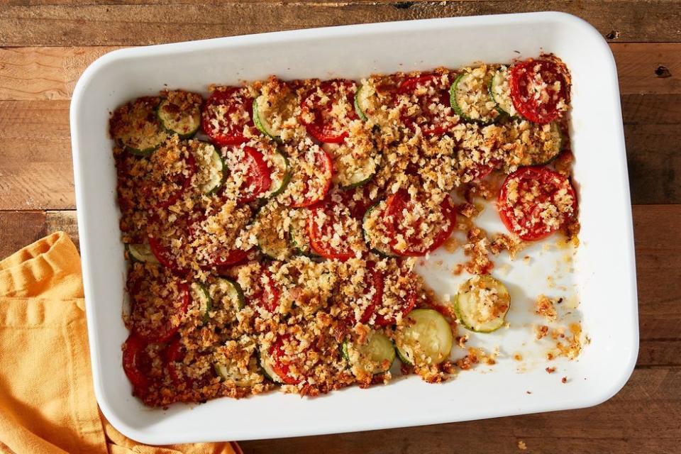 <p>Summery zucchini and tomatoes are a duo that pairs beautifully with any protein. This casserole recipe creates a gorgeous crust of bread crumbs and cheese so good, your family will be begging for seconds. </p><p><em><a href="https://www.delish.com/cooking/a37015351/zuccini-and-squash-casserole-recipe/" rel="nofollow noopener" target="_blank" data-ylk="slk:Get the recipe from Delish »;elm:context_link;itc:0;sec:content-canvas" class="link ">Get the recipe from Delish »</a></em></p>