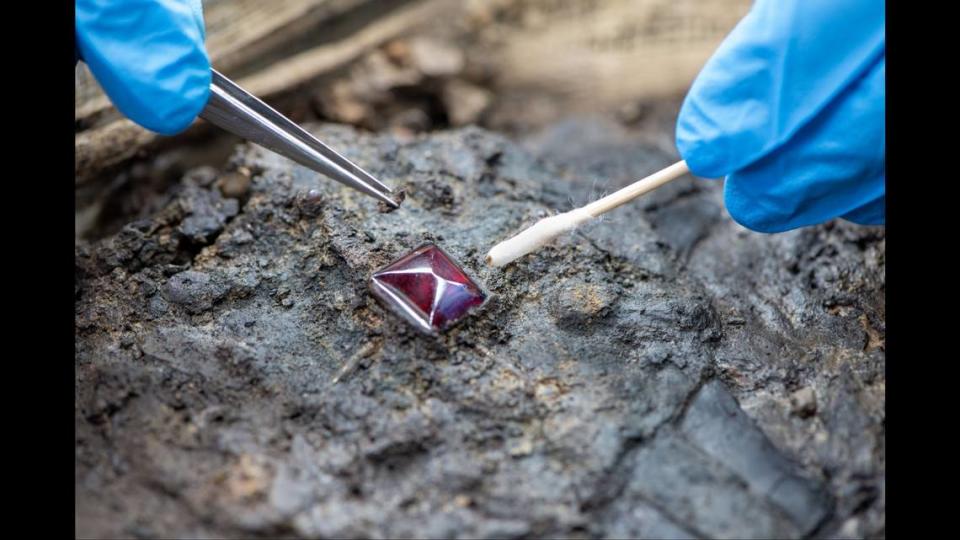 The cross has one large garnet and four smaller garnets, experts said.