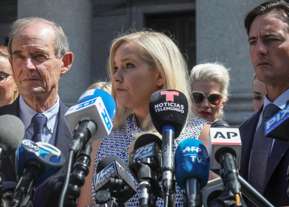 Virginia Giuffre (centre) alleges she was trafficked by convicted sex offender Jeffrey Epstein and sexually abused by Prince Andrew (Bebeto Matthews/AP)