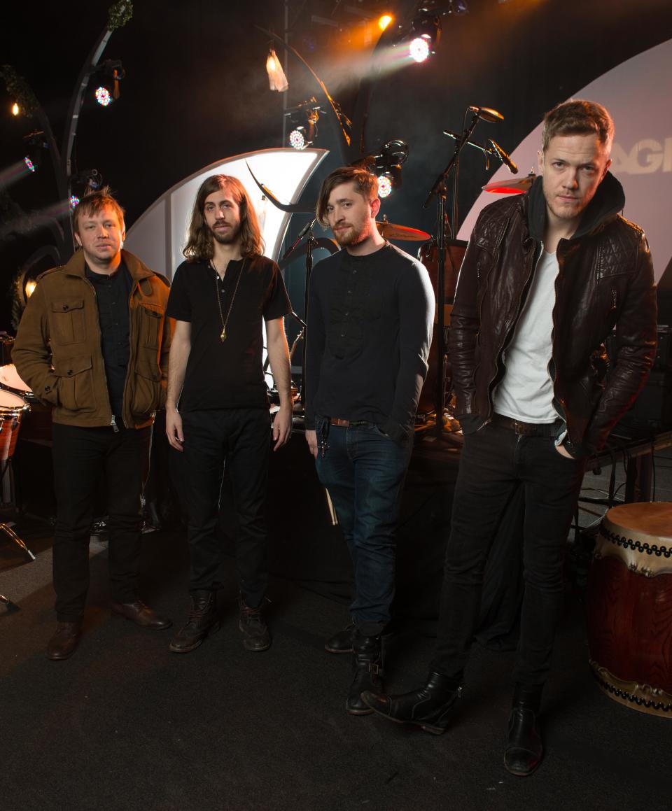 In this Feb. 6, 2013 photo, Las Vegas-based rock band Imagine Dragons, from left, Ben McKee, Wayne Sermon, Dan Platzman and Dan Reynolds pose for a group portrait in Las Vegas. The band's debut album “Night Visions,” has reached gold status and features the hits “It’s Time” and “Radioactive.” The foursome, signed to music producer Alex da Kid’s label imprint, is currently on a U.S. tour. (Photo by Al Powers/ Powers Imagery/Invision/AP)