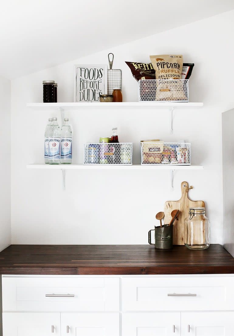 <p>Turn a kitchen nook into a pantry by hanging shelves and making custom containers. These wire baskets have homemade leather straps, with DIY steps included so you can make your own.</p><p><strong>Get the tutorial at <a href="https://themerrythought.com/diy/diy-leather-labels/" rel="nofollow noopener" target="_blank" data-ylk="slk:The Merrythought" class="link ">The Merrythought</a>.</strong> </p><p><a class="link " href="https://go.redirectingat.com?id=74968X1596630&url=https%3A%2F%2Fwww.walmart.com%2Fsearch%3Fq%3Dwire%2Bbaskets%26facet%3Dretailer_type%253AWalmart&sref=https%3A%2F%2Fwww.thepioneerwoman.com%2Fhome-lifestyle%2Fdecorating-ideas%2Fg32345268%2Fpantry-organization-ideas%2F" rel="nofollow noopener" target="_blank" data-ylk="slk:SHOP WIRE BASKETS">SHOP WIRE BASKETS</a></p>