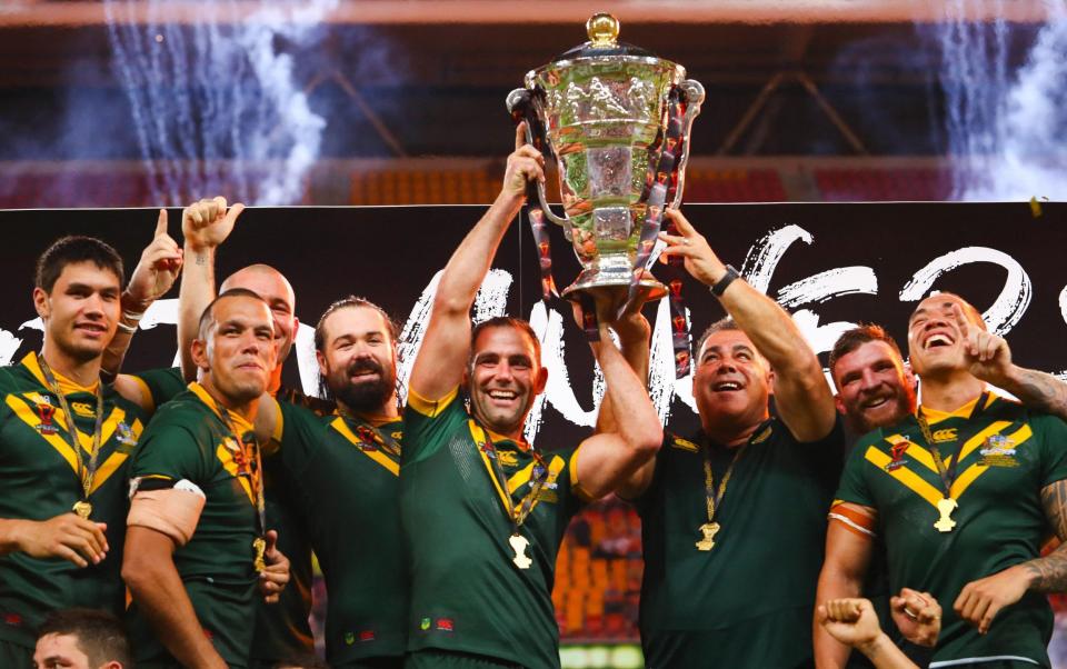  This file photo taken on December 2, 2017 shows Australia celebrating their victory in the Rugby League World Cup men's final match between Australia and England in Brisbane. - Australia and New Zealand pulled out of the 2021 Rugby World Cup in England on July 22, 2021 citing "player welfare and safety" concerns during the Covid-19 pandemic - AFP via Getty Images