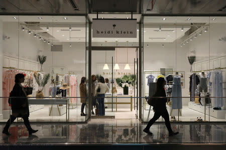 People shop at the Heidi Klein store during the grand opening of the The Hudson Yards development, a residential, commercial, and retail space on Manhattan's West side in New York City, New York, U.S., March 15, 2019. REUTERS/Brendan McDermid