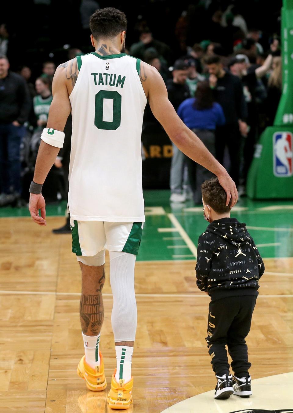 Jayson Tatum #0 of the Boston Celtics walks with his son Deuce after losing to the Miami Heat 106-98 at the TD Garden on March 30, 2022 in Boston, Massachusetts