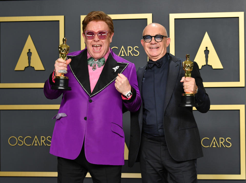 HOLLYWOOD, CALIFORNIA - FEBRUARY 09: Musician Elton John and lyricist Bernie Taupin, winners of the Original Song award for “’(I'm Gonna) Love Me Again,’ Rocketman,” pose in the press room during the 92nd Annual Academy Awards at Hollywood and Highland on February 09, 2020 in Hollywood, California. (Photo by Amy Sussman/Getty Images)