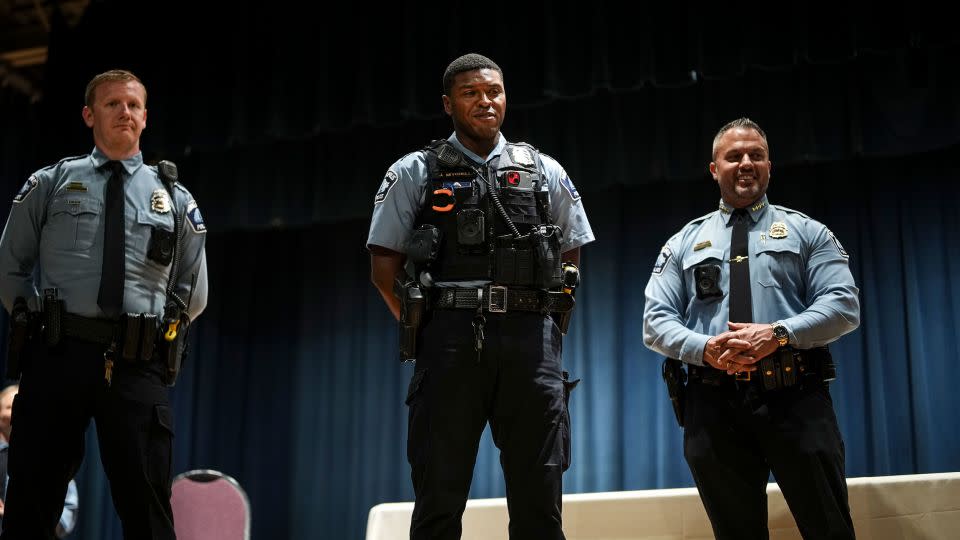 Officer Jamal Mitchell, center, is honored with a Lifesaving Award by Minneapolis Police Chief Brian O'Hara during a ceremony on October 4, 2023. - Renée Jones Schneider/Star Tribune/AP