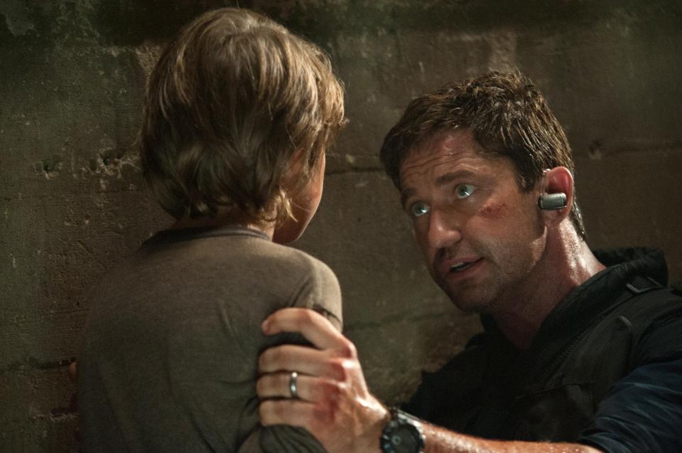 Finley Jacobsen, left, and Gerard Butler in a scene from "Olympus Has Fallen."