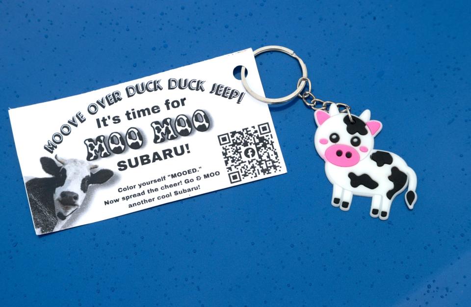 Pamela Pitlanish of Clinton Township, Mich., places on Subaru's that she sees out in public keychains like these that she has on Tuesday. Pitlanish, who is the owner of a 2021 Subaru Crosstrek is also a member of the Moo Moo Subaru Facebook group who also love their Subarus and do a similar thing. Jeep owners started this trend but with rubber duckies that can often be seen on the dashboards of their Jeeps.