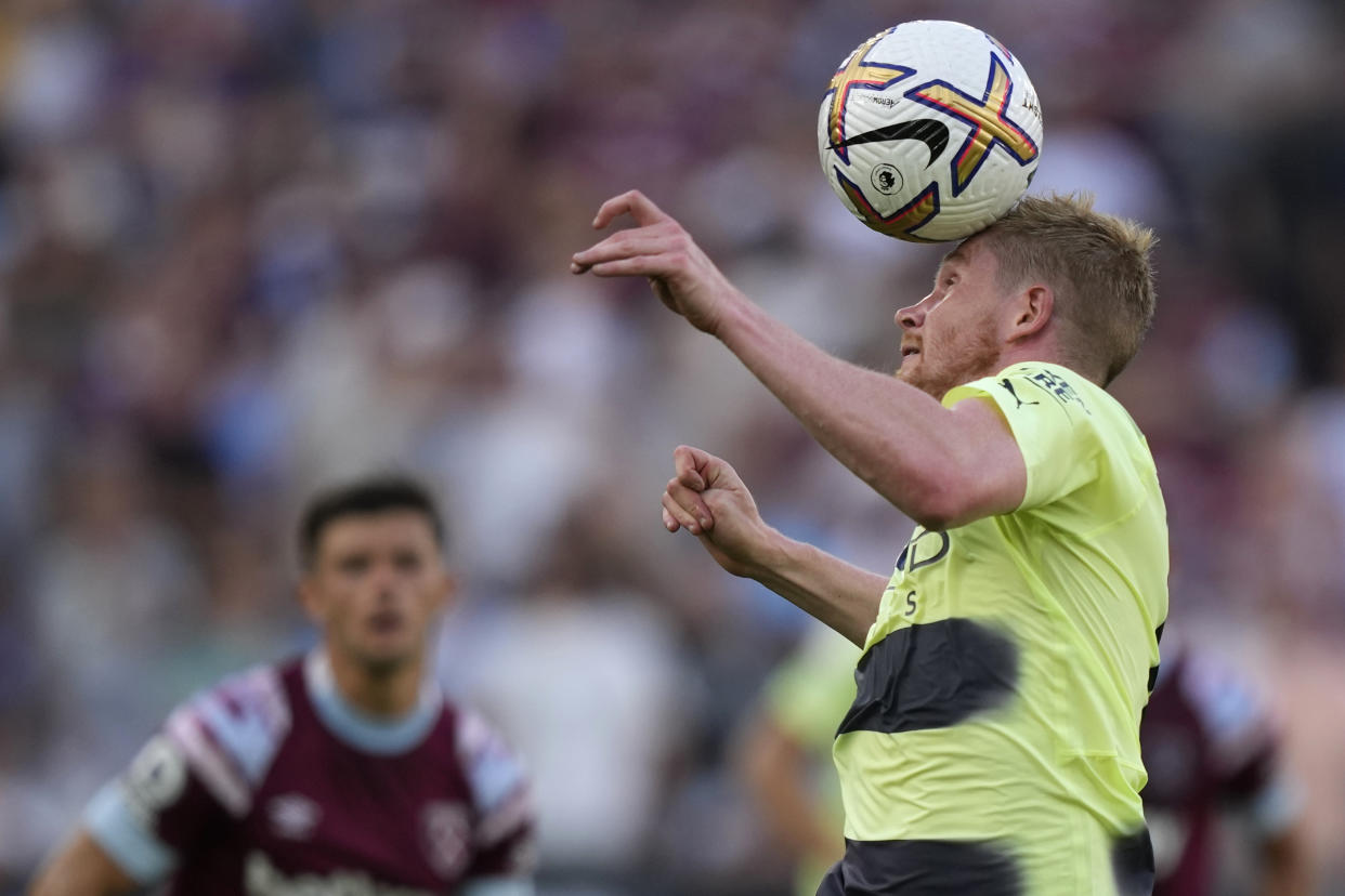 Manchester City's Kevin De Bruyne heads the ball during their English Premier League soccer match between West Ham United and Manchester City at the London Stadium in London, England, Sunday, Aug. 7, 2022. (AP Photo/Frank Augstein)