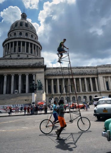 Cuban Felix Guirola rides his giant bicycle on a street in Havana on June 29. For years, he has earned stares of astonishment from fellow Cubans as he pedals his giant bicycle down the streets of Havana