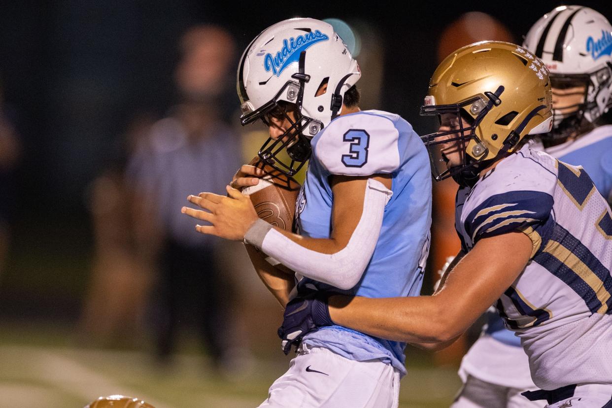 New Prairie's Jacob Meyers makes the tackle on Saint Joseph's Alex Ortiz during the New Prairie-Saint Joseph high school football game on Friday, September 17, 2021, at Father Bly Field in Leighton Stadium in South Bend, Indiana.