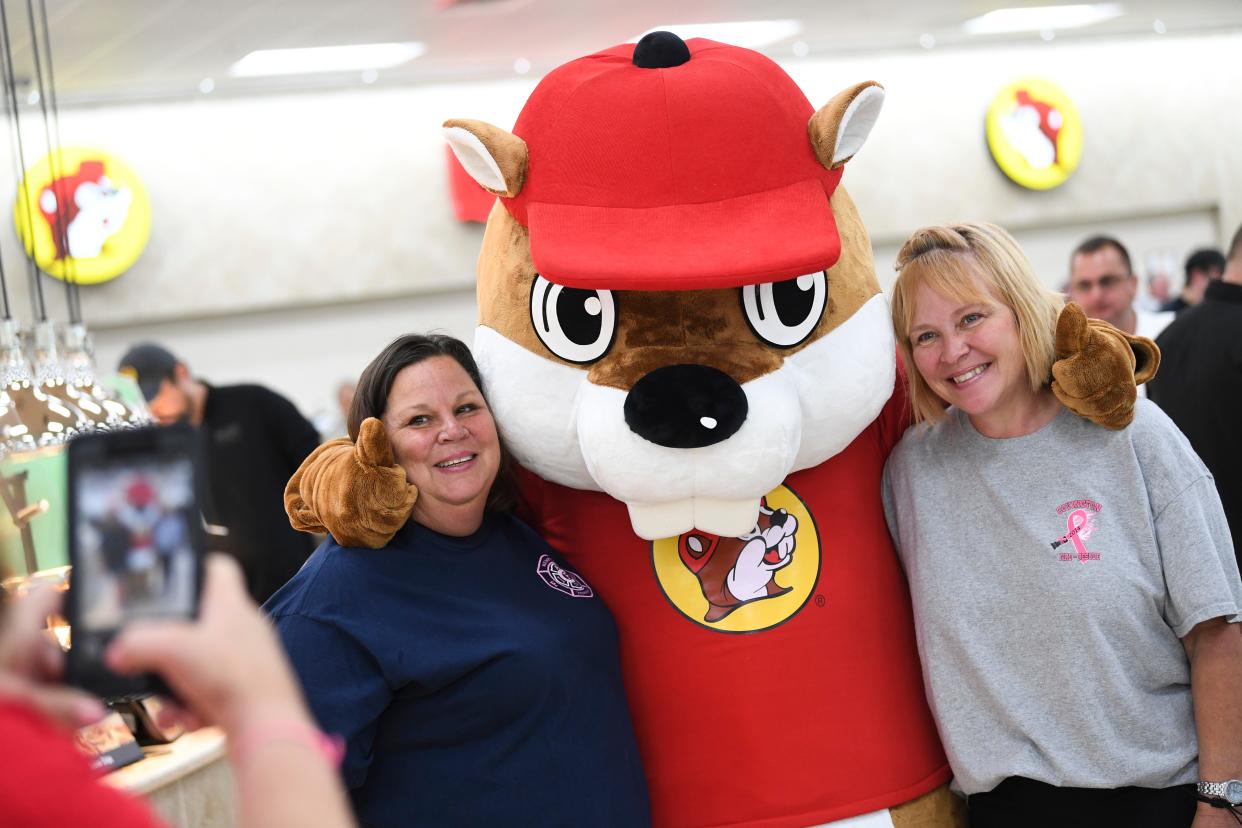 Kim Cochran and Sharolyn Conrad of Memphis Fire, pose for a photo with the Buc-ee’s mascot, at a pre-opening event for first responders at the new Buc-ee’s at 170 Buc-ee’s Boulevard in Sevierville, Friday, June 23, 2023.