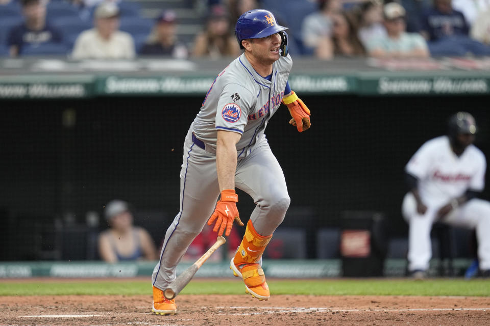 New York Mets' Pete Alonso drops his bat as he runs to first base with a single in the sixth inning of a baseball game against the Cleveland Guardians, Monday, May 20, 2024, in Cleveland. (AP Photo/Sue Ogrocki)