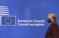 Germany's Chancellor Angela Merkel arrives to a round table meeting at an EU summit in Brussels, Friday, Oct. 22, 2021. European Union leaders conclude a two-day summit on Friday in which they discussed issues such as climate change, the energy crisis, COVID-19 developments and migration. (John Thys, Pool Photo via AP)