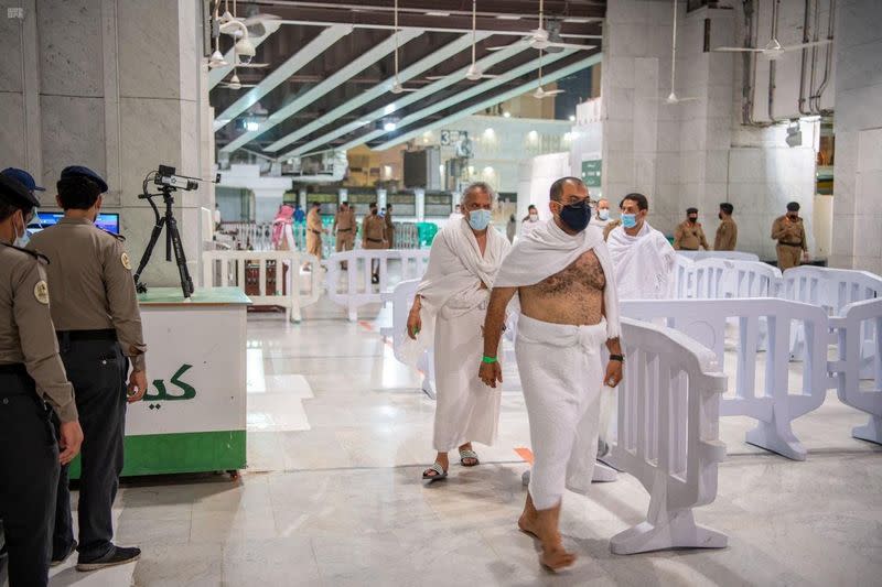 First group of Muslims arrive at the Grand Mosque to perform Umrah after Saudi authorities ease the coronavirus disease (COVID-19) restrictions, in the holy city of Mecca, Saudi Arabia