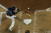 Tampa Bay Rays' Randy Arozarena hits a home run against the Los Angeles Dodgers during the fourth inning in Game 4 of the baseball World Series Saturday, Oct. 24, 2020, in Arlington, Texas. (AP Photo/David J. Phillip)