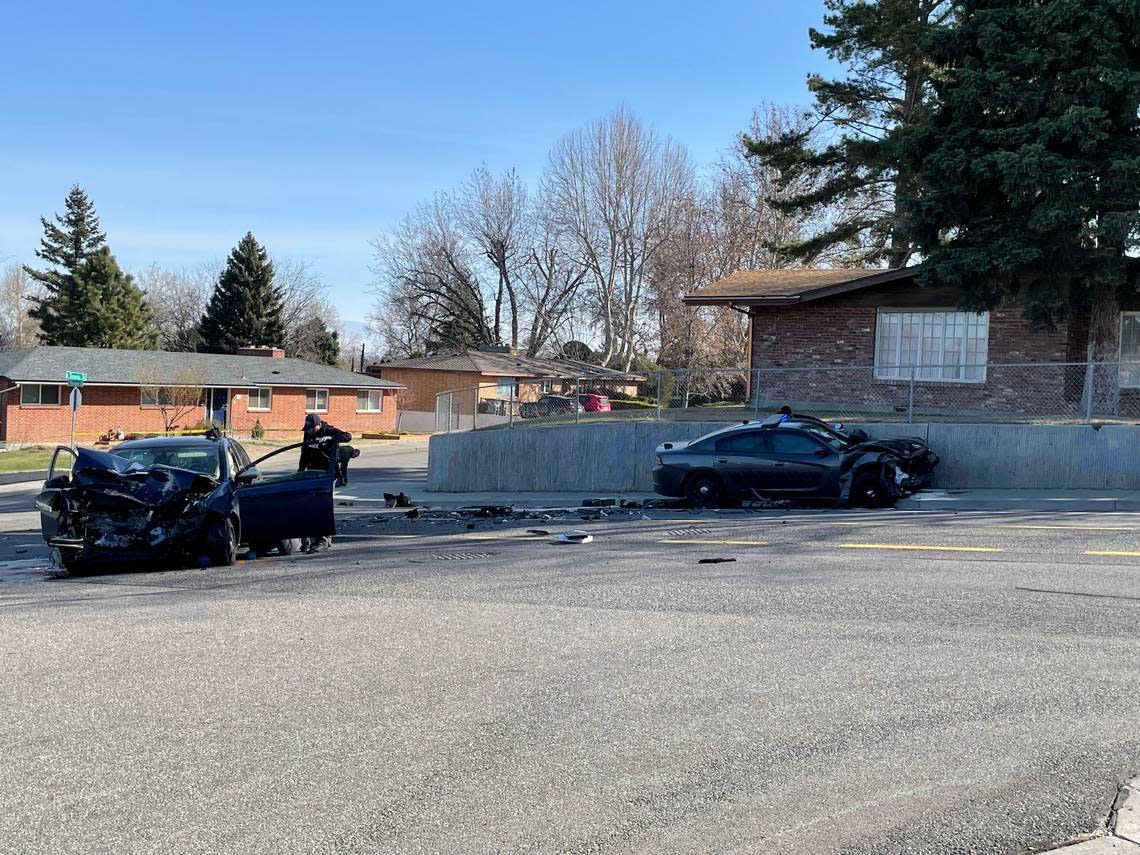 A woman is dead after an early morning crash in Kennewick that started with a shot fired at a police car, followed by a chase involving a Benton County sheriff’s deputy.