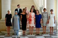 <p>Melania poses with other First Ladies of the world from Iceland, Slovenia, Bulgaria, Turkey, France, and the Queen of Belgium. She dressed for the diplomatic dinner in a Dolce & Gabbana black lace dress and black stilettos. </p>