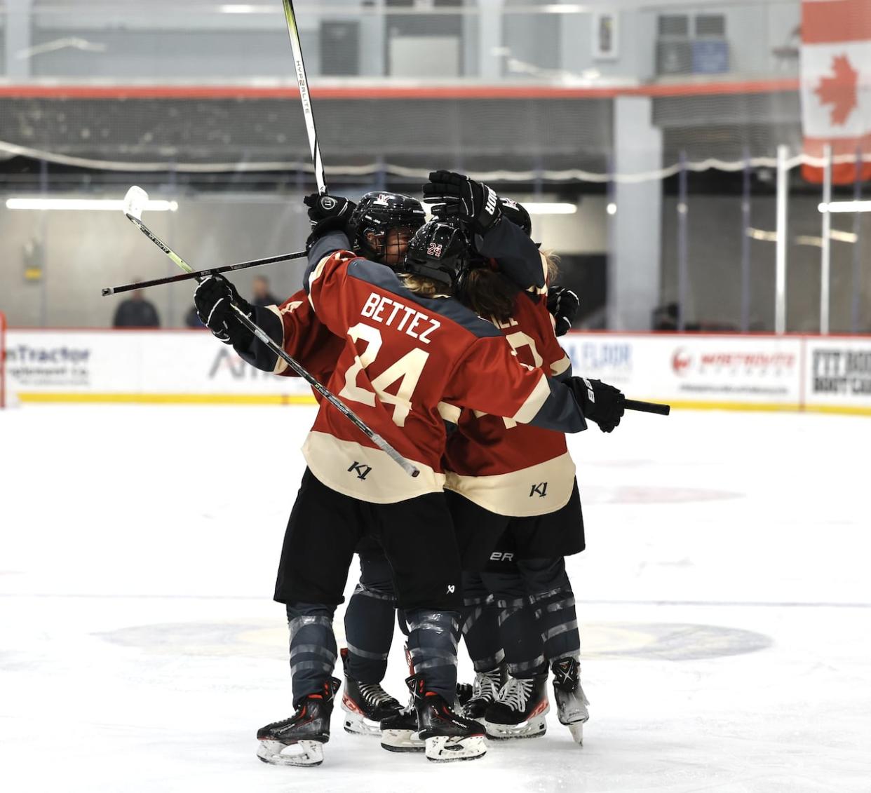 PWHL Montreal players celebrate on the ice during a game against Minnesota in Utica, N.Y., on Thursday. (Heather Pollock/PWHL - image credit)