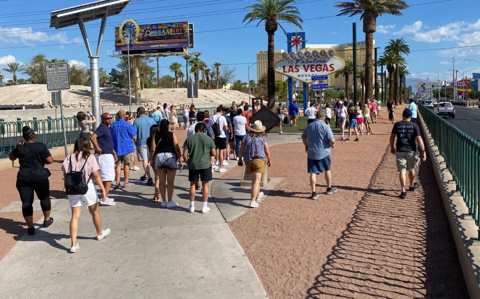 Crowds gather and are already lined up at the “Welcome to Fabulous Las Vegas” sign, this time at 8:45 a.m. on a recent weekday in Las Vegas. The sign is owned by Utah sign company YESCO. | Lee Benson, Deseret News