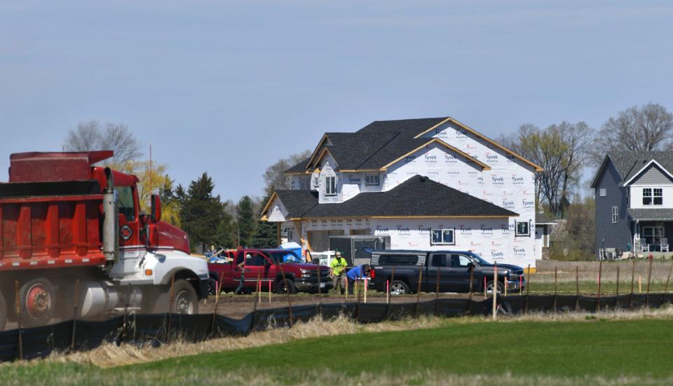 Construction continues on streets and new homes Friday, April 30, 2021, in Sartell. 