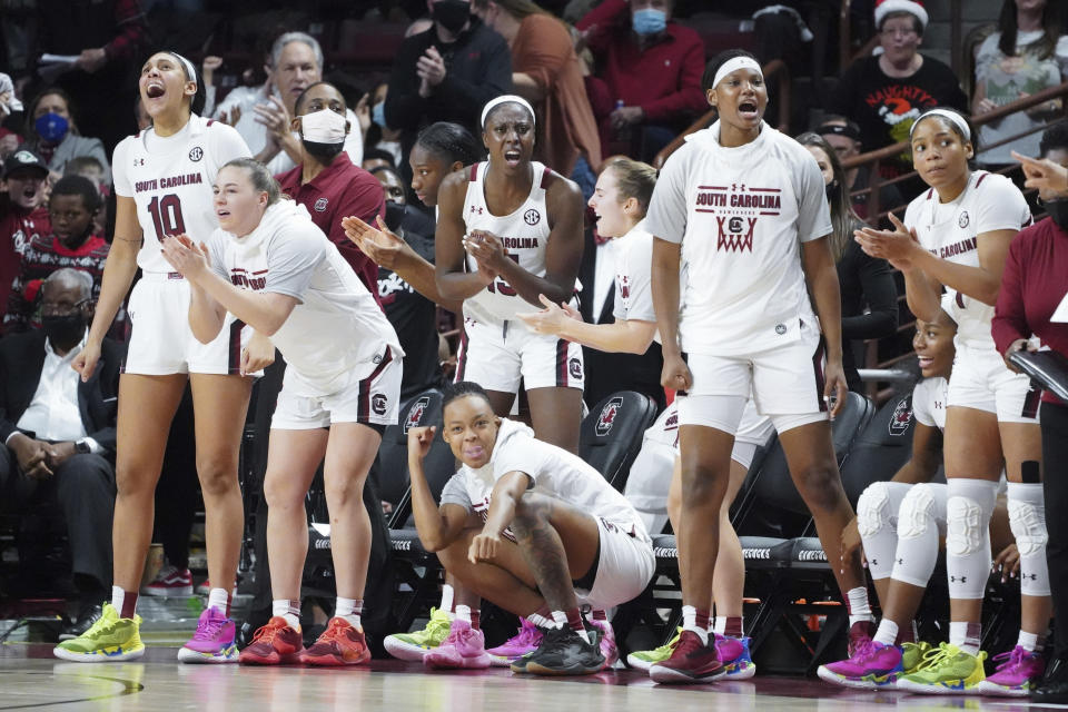 South Carolina players react to a score during the second half of the team's NCAA college basketball game against Stanford on Tuesday, Dec. 21, 2021, in Columbia, S.C. (AP Photo/Sean Rayford)