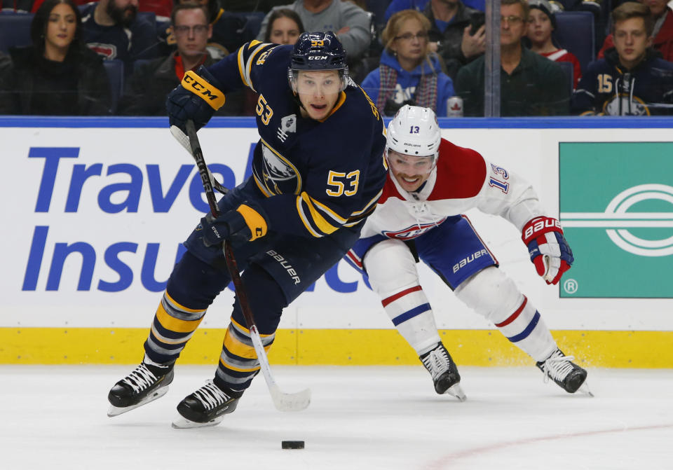 Buffalo Sabres forward Jeff Skinner (53) skates past Montreal Canadiens forward Max Domi (13) during the third period of an hockey game, Friday, Nov. 23, 2018, in Buffalo N.Y. (AP Photo/Jeffrey T. Barnes)