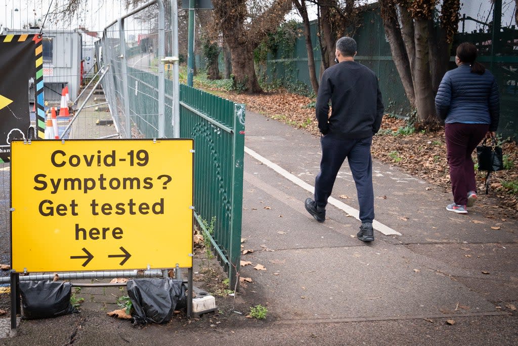 People arrive at a Covid-19 testing centre in Leytonstone, east London (Stefan Rousseau/PA) (PA Wire)