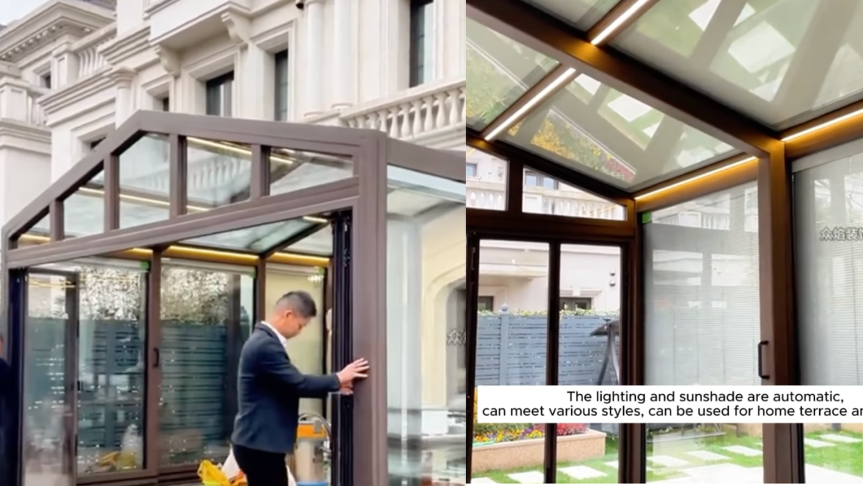 a person standing in front of a building with glass windows