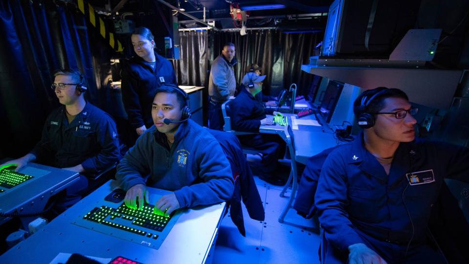 191218-N-RL695-1059 GULF OF MEXICO (December 18, 2019) Operations Specialists assigned to the Arleigh Burke-destoryer USS Thomas Hudner (DDG 116) conducts Tomahawk Exercise procedures inside the Command Information Center as part of a joint force exercise. The Thomas Hudner participated in the first demonstration of the Advanced Battle Management System (ABMS), operators across the Air Force, Army, Navy and industry tested multiple real time data sharing tools and technology in a homeland defense-based scenario enacted by U.S. Northern Command and enabled by Air Force senior leaders held at Eglin Air Force Base, Fla., Dec. 16-18.  (U.S. Navy photo by Mass Communication Specialist 3rd Class Marianne Guemo/Released)