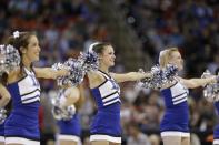 Duke cheerleaders perform during the first half of an NCAA college basketball second-round game against Mercer , Friday, March 21, 2014, in Raleigh, N.C. (AP Photo/Chuck Burton)