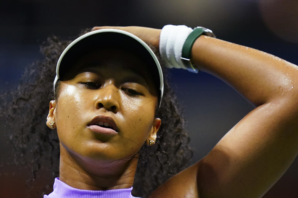 Naomi Osaka, of Japan, reacts after losing a point to Danielle Collins, of the United States, during the first round of the US Open tennis championships, Tuesday, Aug. 30, 2022, in New York. (AP Photo/Frank Franklin II)