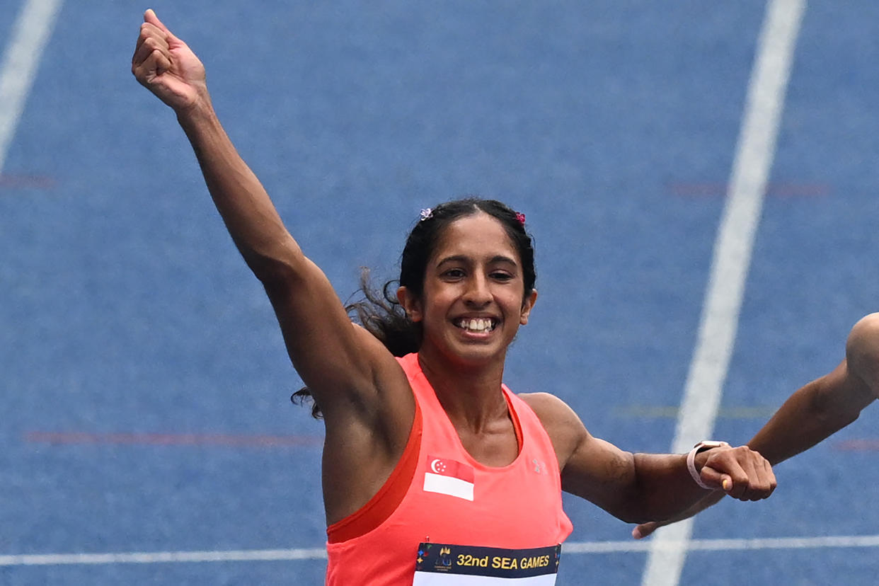 Singapore's Shanti Pereira celebrates after winning the women's 100m gold at the 2023 SEA Games.