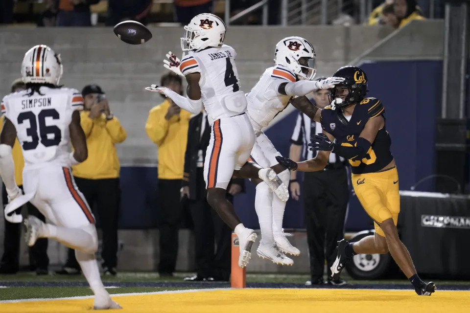 Auburn cornerback D.J. James (4) intercepts a pass in the end zone intended for California wide receiver Trond Grizzell, right, during the second half of an NCAA college football game Saturday, Sept. 9, 2023, in Berkeley, Calif. (AP Photo/Godofredo A. Vásquez)