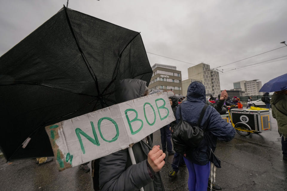 Activists of the C.I.O Comitato Insostenibili Olimpiadi (Unsustainable Olympics Commetee) march in Milan, northern Italy, Saturday, Feb. 10, 2024, against the prospected costs of the 2026 Winter Olympics that will be disputed in Milan and Cortina d'Ampezzo in the Dolomites. (AP Photo/Luca Bruno)