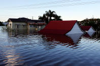 BUNDABERG, AUSTRALIA - JANUARY 29: Houses are flooded as parts of southern Queensland experiences record flooding in the wake of Tropical Cyclone Oswald on January 29, 2013 in Bundaberg, Australia.Four deaths have been confirmed and thousands have been evacuated in Bundaberg as the city faces it's worst flood disaster in history. Rescue and evacuation missions continue today as emergency services prepare to move patients from Bundaberg Hospital to Brisbane amid fears the hospital could lose power. (Photo by Chris Hyde/Getty Images)