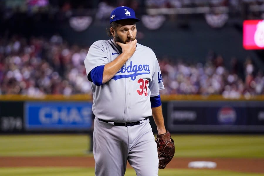 Los Angeles Dodgers starting pitcher Lance Lynn walks off the field at the end of the second inning in Game 3 of a baseball NL Division Series against the Arizona Diamondbacks, Wednesday, Oct. 11, 2023, in Phoenix. (AP Photo/Ross D. Franklin)