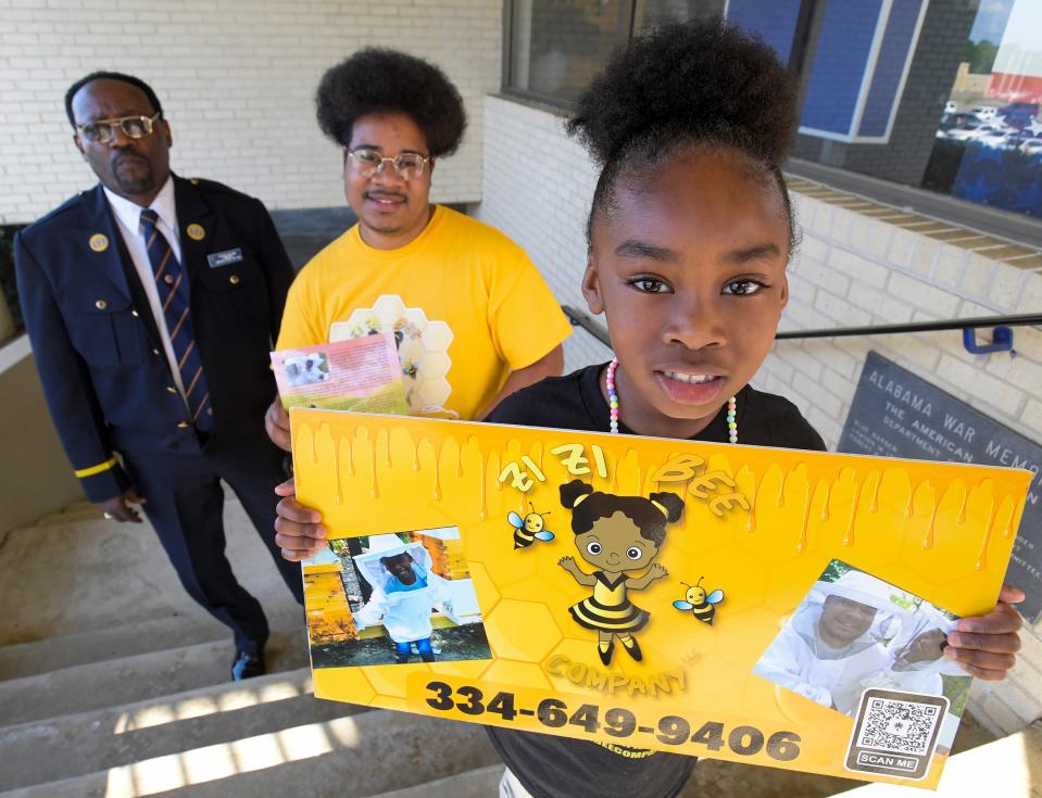 Zuri Yu and her father, Zizi’s Bee Company owner Sam Yu, stand with Frederick Williams, Commander of American Legion 1948 in Montgomery. Sam Yu and Williams have partnered on several community projects.