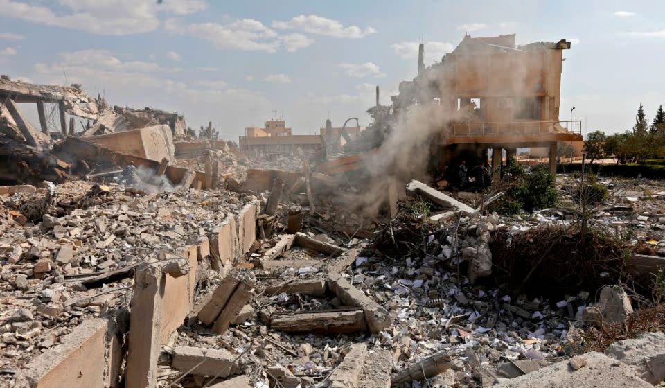 This picture taken on April 14, 2018 shows the wreckage of a building described as part of the Scientific Studies and Research Centre (SSRC) compound in the Barzeh district, north of Damascus. Source: Getty Images.