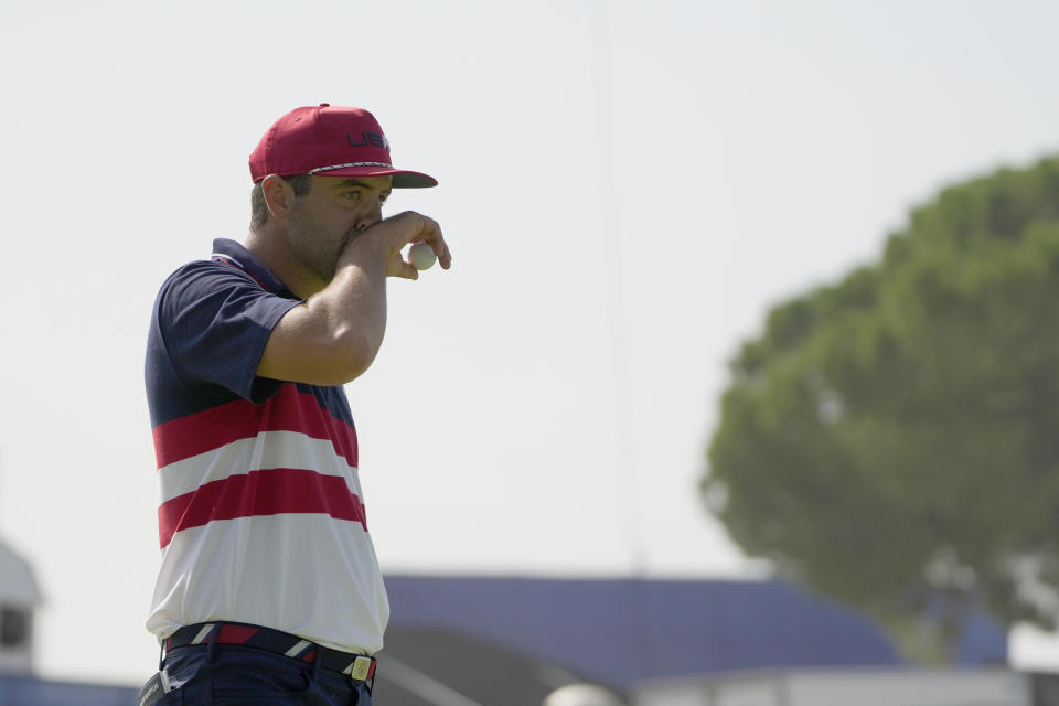 United States' Scottie Scheffler waits to play on the 6th green during his singles match at the Ryder Cup golf tournament at the Marco Simone Golf Club in Guidonia Montecelio, Italy, Sunday, Oct. 1, 2023. (AP Photo/Gregorio Borgia)