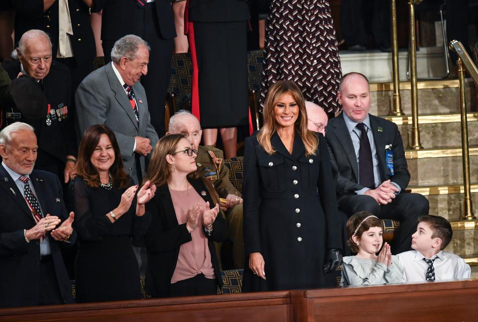 Melania Trump is surrounded by special guests of the president, including Buzz Aldrin at left, as she arrives at the State of the Union. (Photo: Mandel Ngan/AFP/Getty Images)