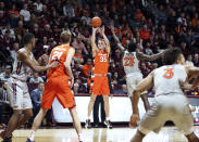 Syracuse's Buddy Boeheim (35) shoots 3 -point shot over the Virginia Tech defense during the first half of an NCAA college basketball game in Blacksburg Va., Saturday, Jan. 18 2020. (Matt Gentry/The Roanoke Times via AP)