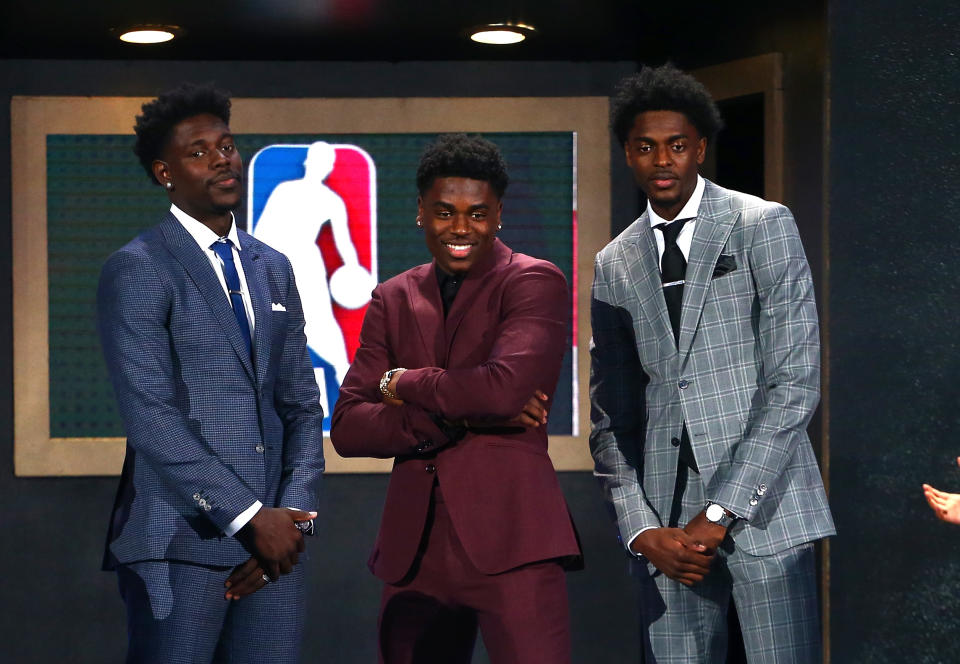 Aaron Holiday (center) poses with brothers Justin Holiday and Jrue Holiday during the 2018 NBA Draft at the Barclays Center on June 21, 2018. 