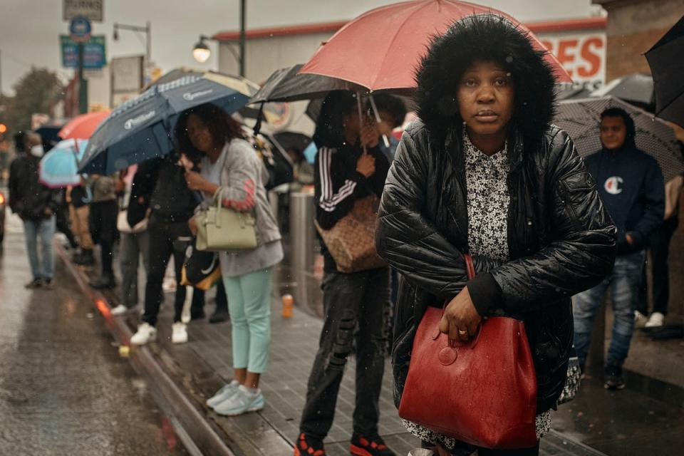 People wait for the bus as trains were cancelled last Friday across large parts of New York following a severe storm (Copyright 2023 The Associated Press. All rights reserved.)
